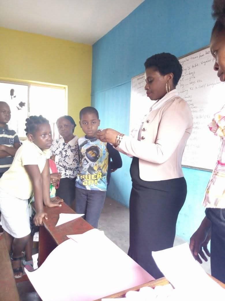 Teacher assisting a pupil